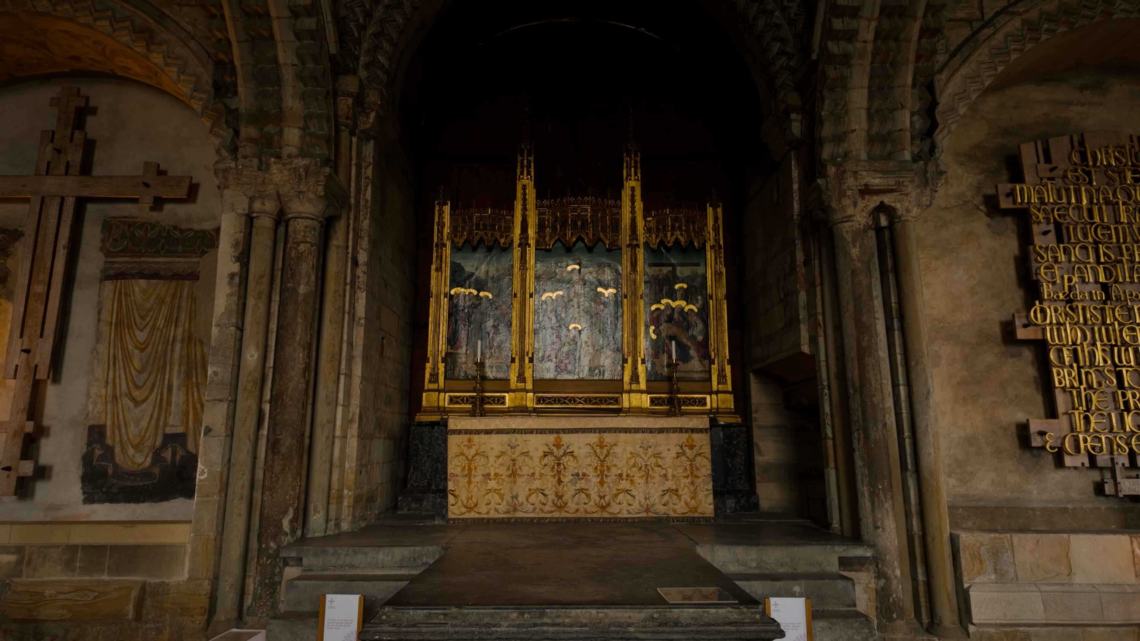 A church altar adorned with intricate gold and wood decorations