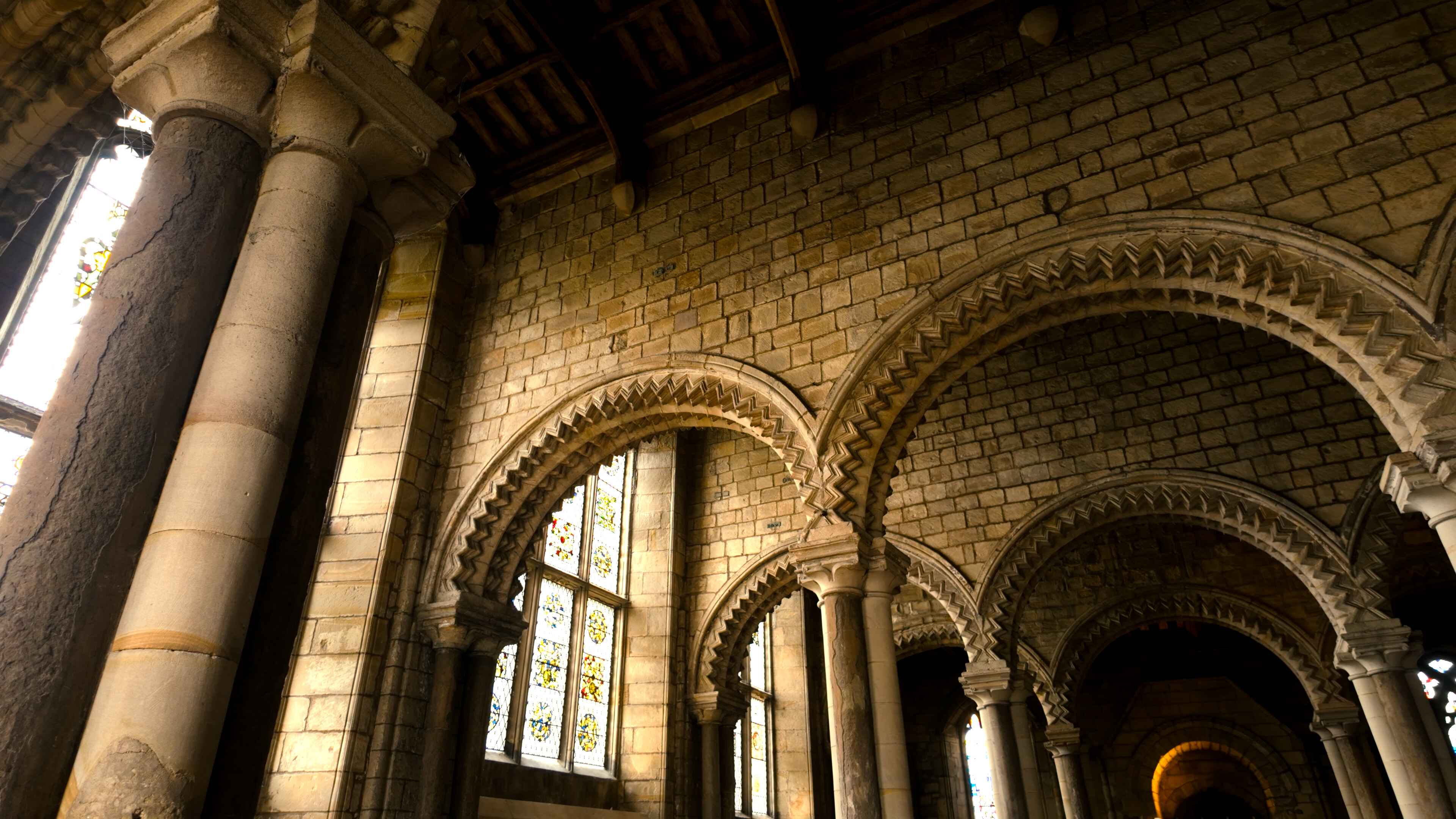 Interior view of a church featuring elegant arches and sturdy pillars